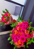 Pink and orange mixed rose bouquet.