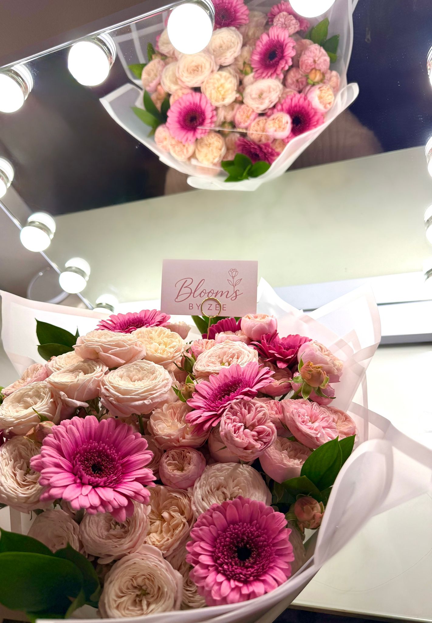 Mixed pink and white spray rose bouquet.