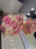 Large mixed pink spray rose bouquet.