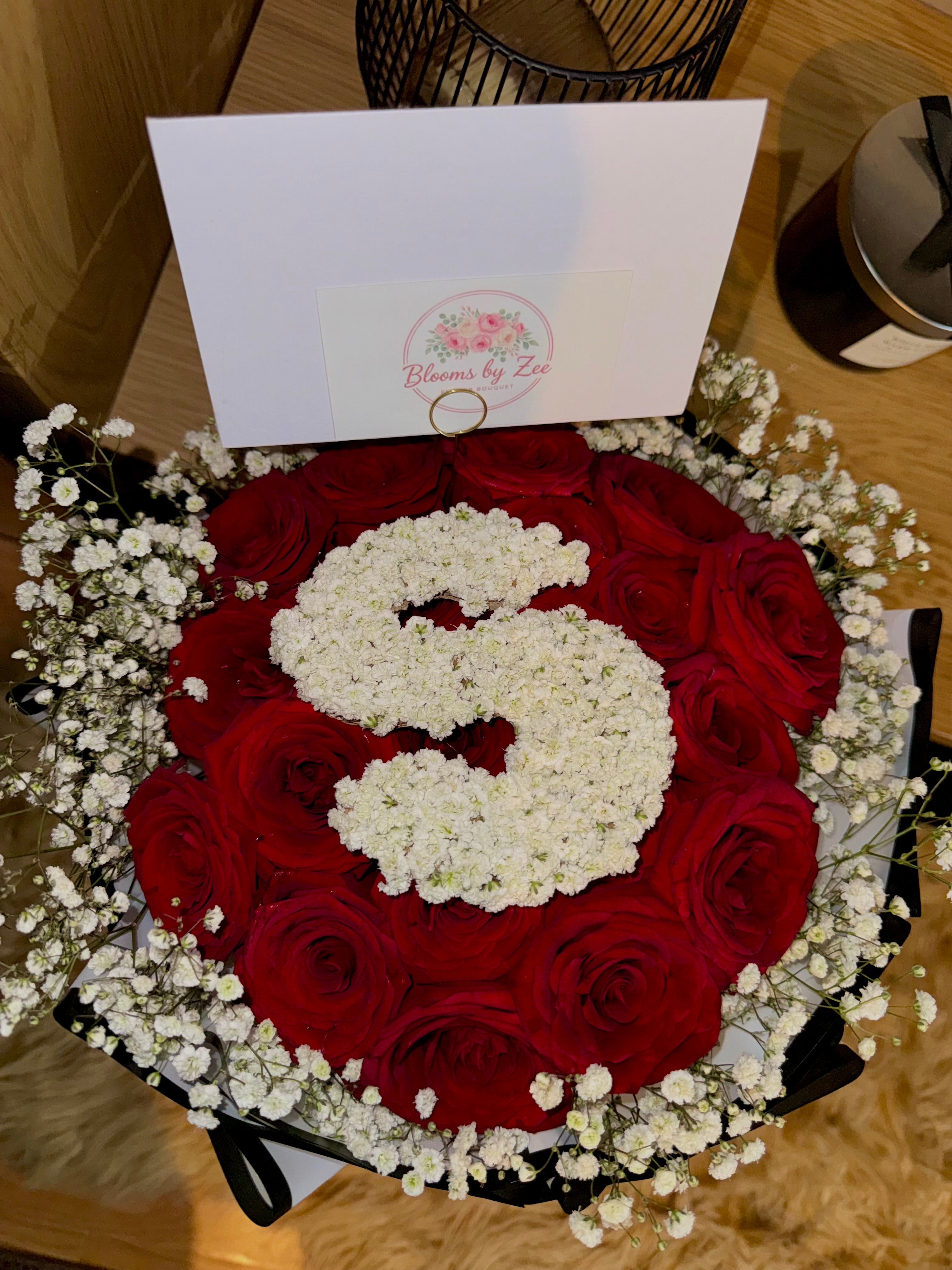 Medium red rose bouquet with Gyps lettering.
